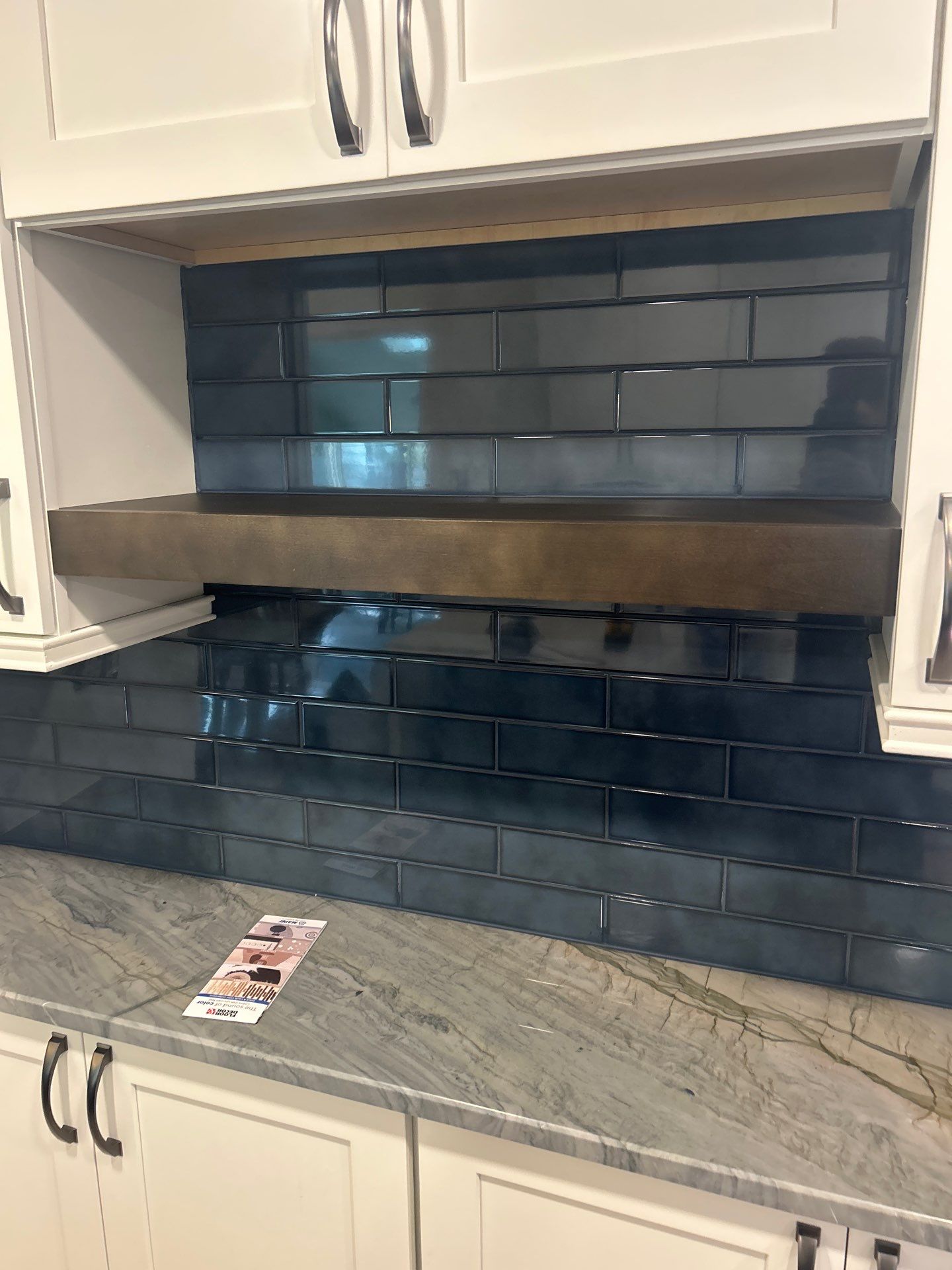 Blue tile kitchen backsplash by Elixtro Renovations